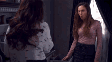 two women are standing next to each other with the word wink in the background