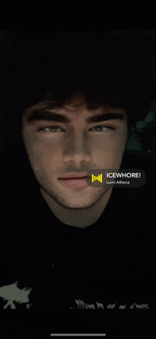 a close up of a man 's face with the words icewhore on the bottom right