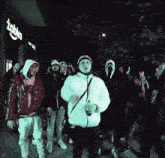 a group of people are standing in front of a store that says zobka