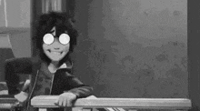a black and white cartoon character is leaning on a railing .