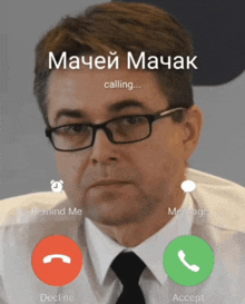 a man wearing glasses is talking on a phone with the word calling on the screen