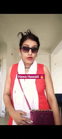 a woman wearing sunglasses and a red top says hawa hawaii