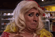 a close up of a person wearing a wig