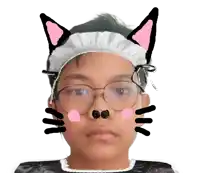 a boy wearing glasses and a headband with cat ears