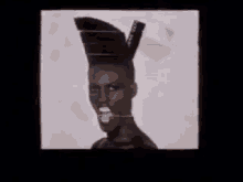 Put Some Grace In Your Face. GIF - Slave To The Rythm Grace Jones Afro Mohawk GIFs