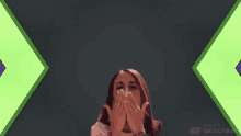 a woman is covering her mouth with her hands and the words made with unscreen are visible in the corner