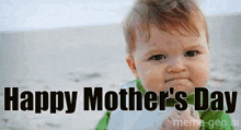 a baby is holding a piece of paper with the words happy mother 's day written on it