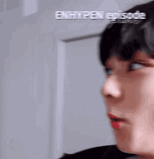 a blurry picture of a person 's face with the words enhypen episode written above it