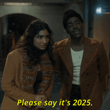 a man and a woman standing next to each other with the words please say it 's 2025