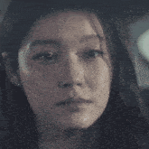 a woman is crying with a tear running down her face
