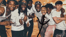 a group of young men are posing for a picture and one of them is wearing a shirt that says ' r ' on it