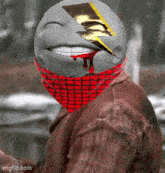 a man with a smiley face and a lightning bolt on his face is wearing a red plaid bandana
