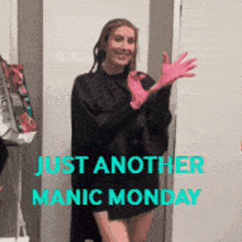 a woman wearing pink gloves with the words just another manic monday behind her