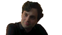 a man in a black shirt is holding a glass of whiskey and smiling