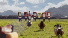 a group of people dressed up as ketchup bottles in a field
