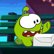 a green cartoon character is sitting on a bench with an envelope next to him