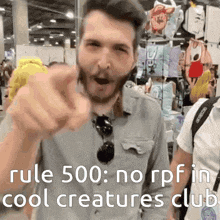 a man with a beard is pointing at the camera with the words rule 500 : norpf in cool creatures club .