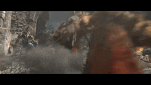 a group of people are fighting each other in a video game in a ruined city .
