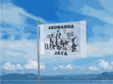 a flag that says arowarna jaya is on a pole