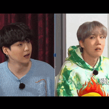 a man in a blue sweater and a man in a green tie dye hoodie with fire on it