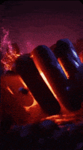 a purple and orange background with a blue object floating in the air