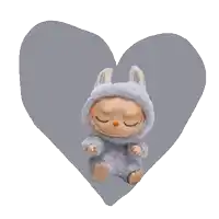 a stuffed animal in a bunny costume is sitting in front of a heart