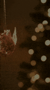 a blurred image of a christmas tree with a pink and yellow border