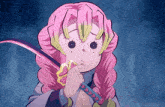 a girl with pink hair is holding a sword in her hand and making a funny face .