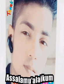 a young man is wearing headphones and says " assalamu ' alaikum "