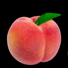 a peach with a green leaf and a yellow hand