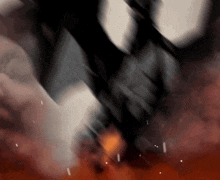 a blurry picture of a person 's face with smoke coming out of their mouth