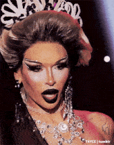a close up of a drag queen 's face with t4yce tumblr written underneath