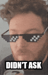 a man wearing sunglasses with the words did n't ask above him
