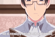 a man with glasses is reading a book with the words he is reading hetalia shota doujins