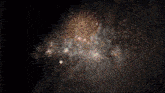 a fireworks display in the night sky with a black background