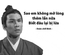 a black and white photo of a man in a kimono with a bun on his head
