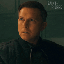 a close up of a man 's face with the words saint-pierre written on the bottom