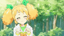 a girl with yellow hair and green leaves on her head is smiling