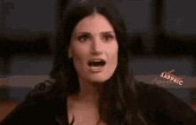 a woman is making a funny face with the word sapphic visible in the corner