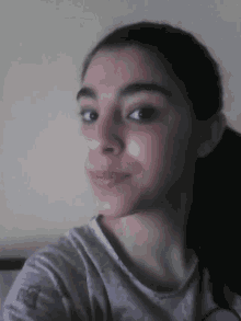 a close up of a woman 's face with her eyes closed