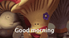 a cartoon mushroom with a flower on it and the words good morning on the bottom