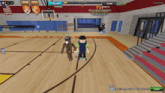 a basketball game is being played in a gym with a pvp banner