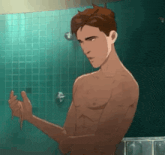 a shirtless man is taking a shower in a bathroom and holding a sponge .