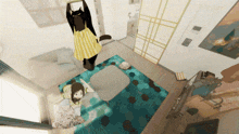 a girl laying on a couch with a cat hanging from the ceiling above her