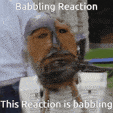 a statue of a man with a beard and a caption that says babbling reaction