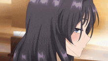 a close up of a girl with long black hair