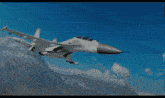 a fighter jet is flying over a mountain range