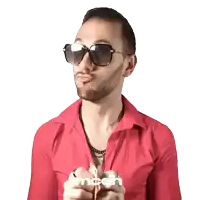 a man wearing sunglasses and a red shirt says mcdh on the bottom right