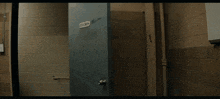 a man in a suit is standing in a dark room