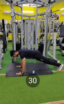 a man is doing push ups in a gym with the number 30 in the circle